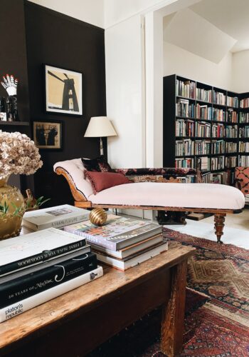 choclate brown wall in alcove, pink chaise longue, large corner book shelves in the sitting room at madaboutthehouse.com